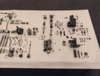 Components on display of a Woodward manufactured GE CF6-80C series jet engine fuel control (MEC).